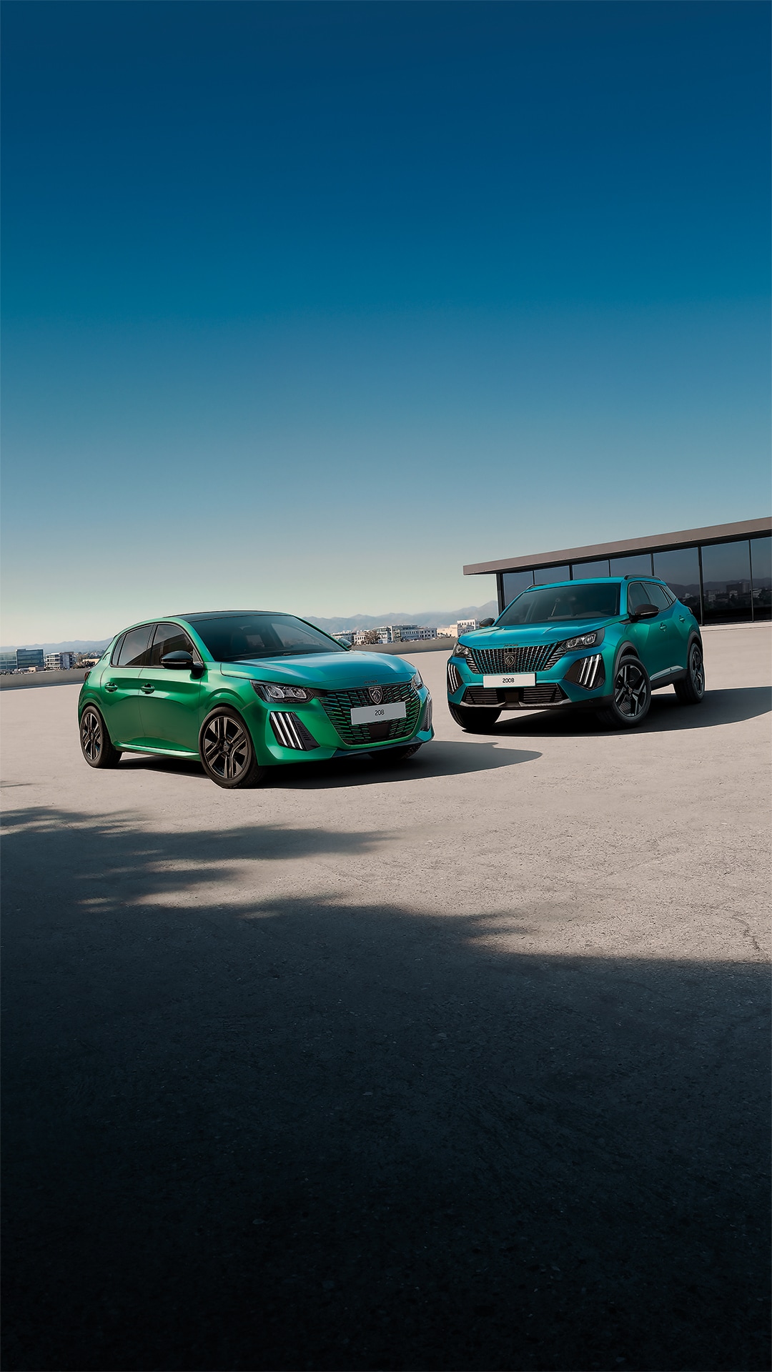 PEUGEOT 205 GTi and PEUGEOT E-208 GTi driving side by side